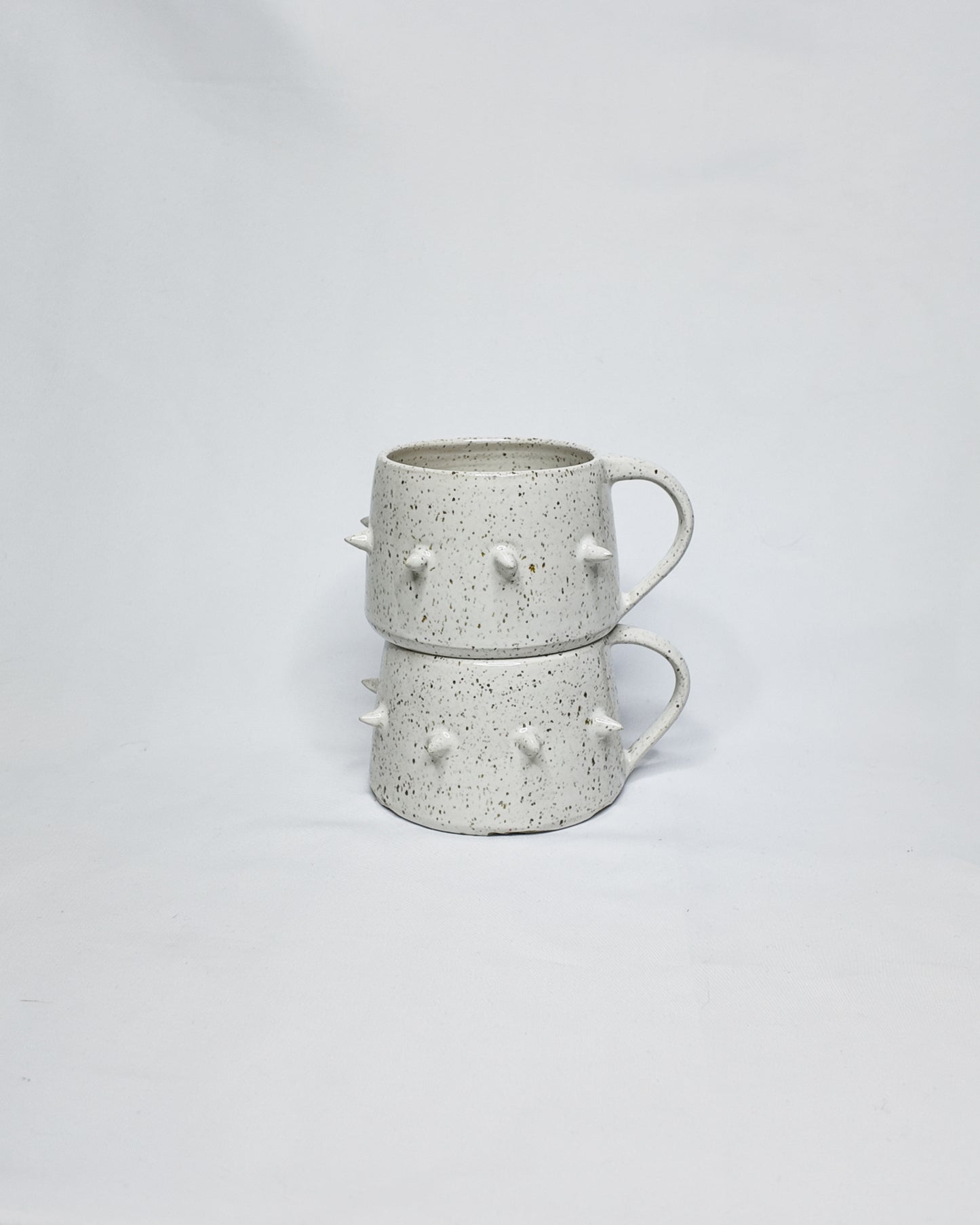 Speckled spiky mug