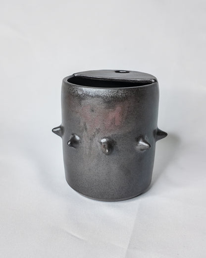 Spiky ceramic travel cup