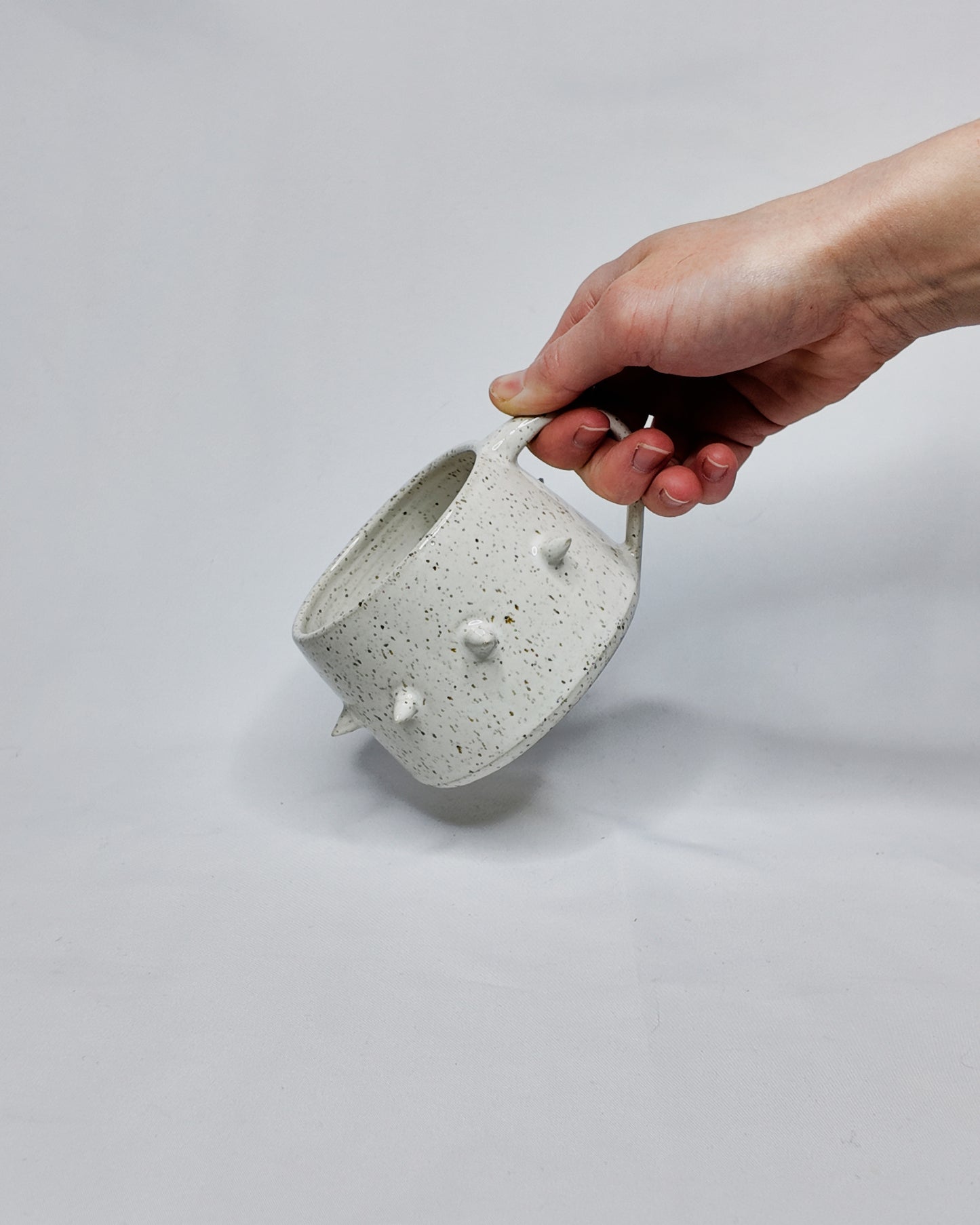 Speckled spiky mug