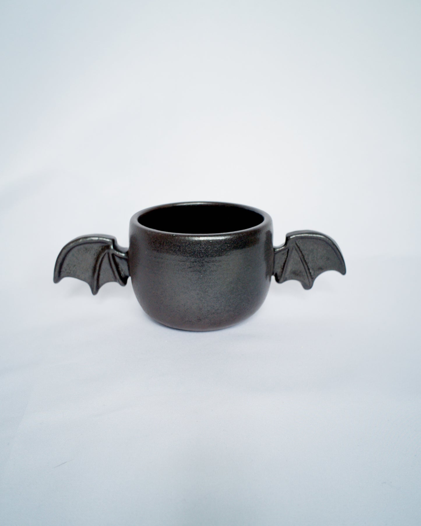 Double bat cup