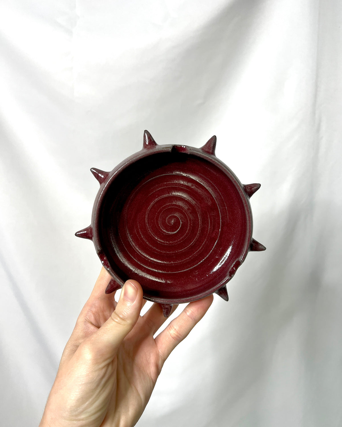 Red spiky ash tray