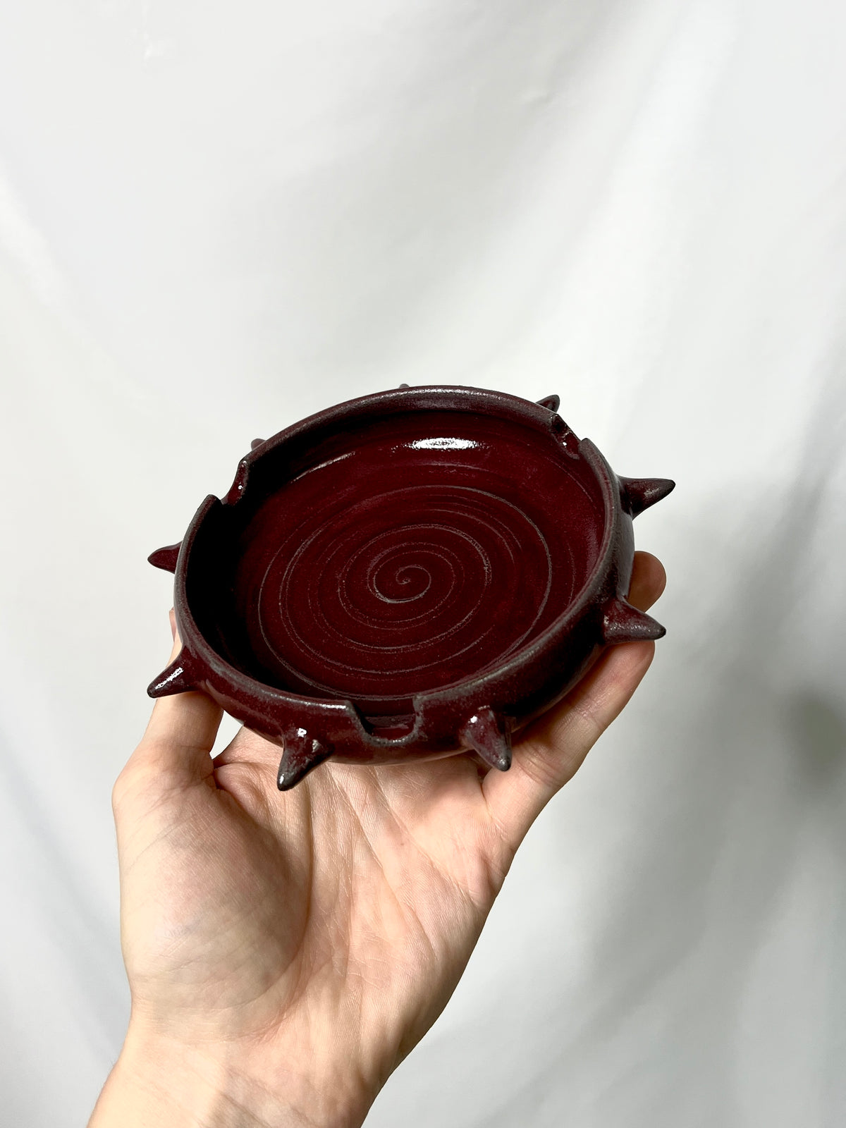 Red spiky ash tray